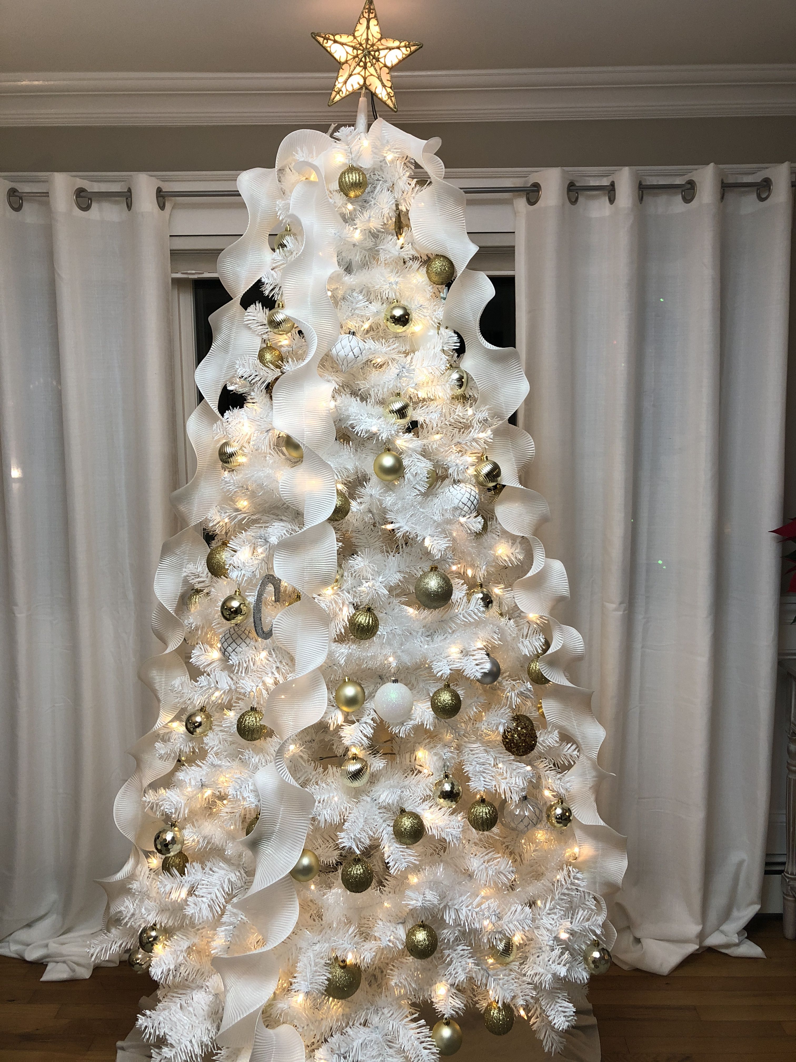 White Christmas Trees Decorated With Ribbons And Elegance